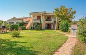 a large house with a yard in front of it at Trilo 6 in Budoni
