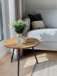 a coffee table in a living room with a couch at Ferienwohnung Baltic Idyll in Scharbeutz