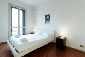 Posteľ alebo postele v izbe v ubytovaní Washington Apartment
