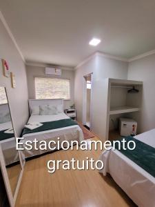 Postel nebo postele na pokoji v ubytování Hotel Hiperion Maringá