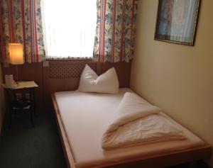 Posteľ alebo postele v izbe v ubytovaní Hotel Pension Alte Mühle