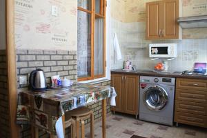 a kitchen with a washer and a washing machine at Apartment on Mira 4/1 in Kislovodsk