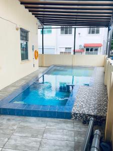a swimming pool on the roof of a building at Casa Drezqi Homestay Melaka Private Pool in Melaka