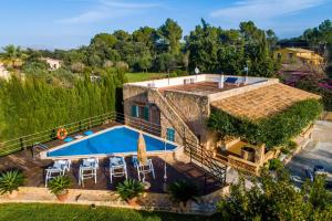 an aerial view of a house with a swimming pool at Ideal Property Mallorca - Sa Vinya Vella in Alcudia