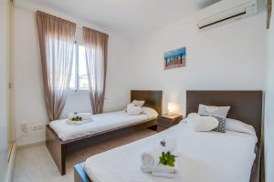 Ein Bett oder Betten in einem Zimmer der Unterkunft Ideal Property Mallorca - Son Moleto