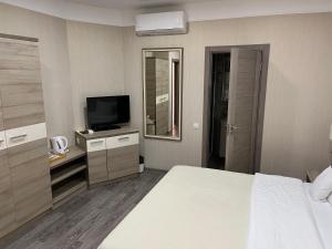 Katil atau katil-katil dalam bilik di Elite Hotel