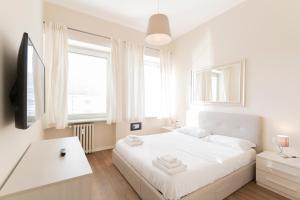 Posteľ alebo postele v izbe v ubytovaní Via Torino Apartment 3