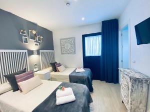 TV a/nebo společenská místnost v ubytování Hostal Alisol Boutique San Pedro