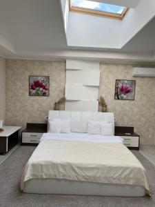 Katil atau katil-katil dalam bilik di Elite Hotel