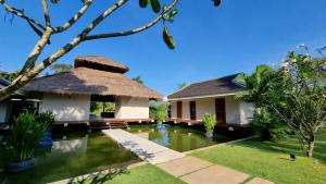a villa with a swimming pool in a resort at Khla Lodge in Kampot +130 photos