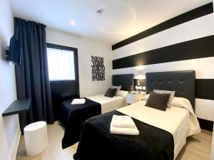 Postel nebo postele na pokoji v ubytování Hostal Alisol Boutique San Pedro