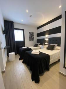 Postel nebo postele na pokoji v ubytování Hostal Alisol Boutique San Pedro
