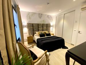 Postel nebo postele na pokoji v ubytování Hostal Alisol Boutique San Pedro