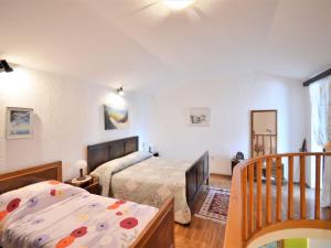 Postel nebo postele na pokoji v ubytování Holiday Home Latin by Interhome