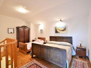 Postel nebo postele na pokoji v ubytování Holiday Home Latin by Interhome