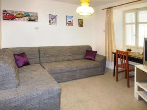 a living room with a couch and a table at Holiday Home Helena - Pag310 by Interhome in Pag