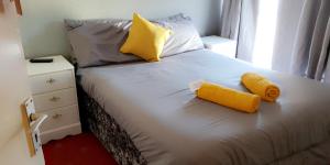 a bedroom with a bed with two towels on it at Bel Reve Hotel in Blackpool