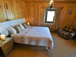 A bed or beds in a room at Apartment Trepalle by Interhome