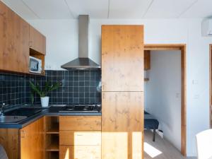 A kitchen or kitchenette at Holiday Home Mandorlo - SLR401 by Interhome Még 19 kép