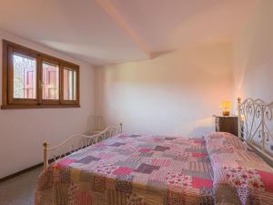 A bed or beds in a room at Holiday Home Villa Magna by Interhome