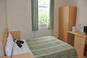 Postel nebo postele na pokoji v ubytování European Hotel
