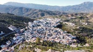 an aerial view of a village in the mountains at Casa Linda in Guaro