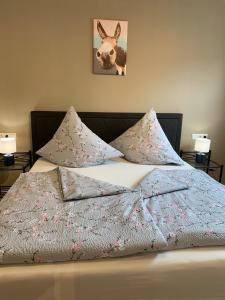 Ένα ή περισσότερα κρεβάτια σε δωμάτιο στο Ferienwohnungen Bohner/Ferienwohnung Maria