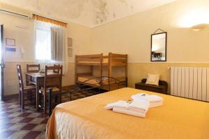 Postel nebo postele na pokoji v ubytování Agriturismo Case Don Ignazio