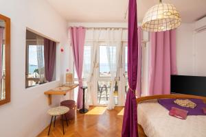 Ein Bett oder Betten in einem Zimmer der Unterkunft Golden View Apartment