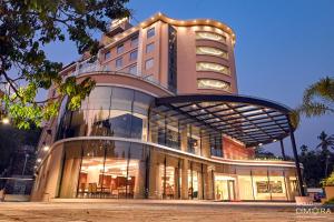 a large building with a lot of windows at Dimora Kozhikode in Kozhikode