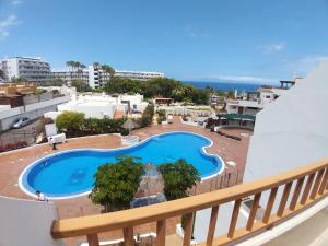 a view of a swimming pool from a balcony at Los Geranios in Adeje