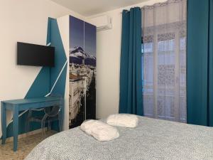 Posteľ alebo postele v izbe v ubytovaní Catania Apartment Borgo Suite Autonomous