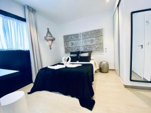 Postel nebo postele na pokoji v ubytování Hostal Alisol Boutique San Pedro
