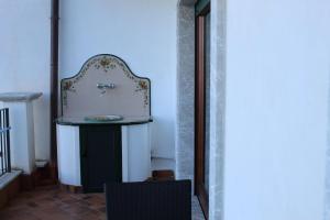 a bathroom with a sink in a room at Villa Sofia in Taormina