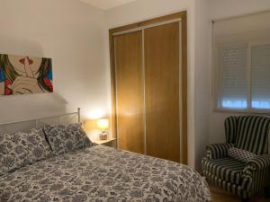 A bed or beds in a room at Palma 2 sueños