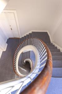 a spiral staircase in a building with a spiralsteeligunigunigunigunigunigun at 175SQM HIGH-END Luxury Apartment - Heart Of Copenhagen in Copenhagen