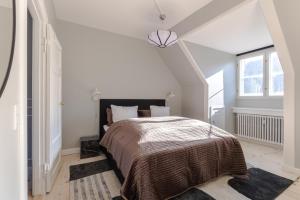 Luxury Apartment w Privat Rooftop Terrace - CPH C tesisinde bir odada yatak veya yataklar