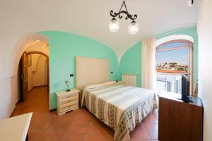 Postelja oz. postelje v sobi nastanitve Albergo La Margherita