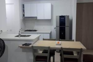 Kuchyň nebo kuchyňský kout v ubytování Hermoso apartamento, con la comodidad de tu hogar!