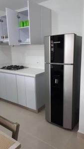 Kuchyň nebo kuchyňský kout v ubytování Hermoso apartamento, con la comodidad de tu hogar!
