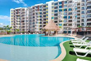 Bazén v ubytování Hermoso apartamento, con la comodidad de tu hogar! nebo v jeho okolí
