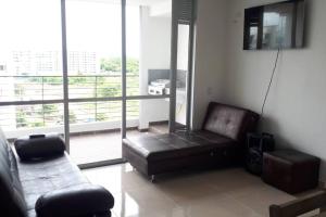 Posezení v ubytování Hermoso apartamento, con la comodidad de tu hogar!