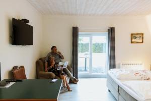 TV a/nebo společenská místnost v ubytování Gasthof De Statie