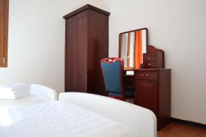 Letto o letti in una camera di b&b Wu Giada