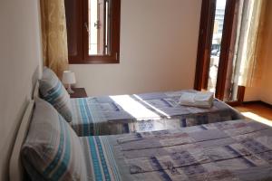 Letto o letti in una camera di b&b Wu Giada