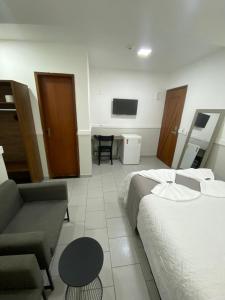 Postel nebo postele na pokoji v ubytování Hotel Caiçara