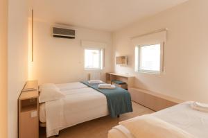 
Uma cama ou camas num quarto em Boavista Guest House

