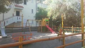 a park with a playground with a slide at Villaggio Calipso in Calopezzati