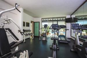 a gym with several treadmills and machines in a room at Fiesta Inn Veracruz Malecon in Veracruz
