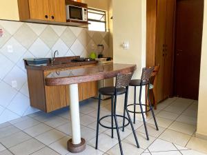 A kitchen or kitchenette at Vilamar Suítes